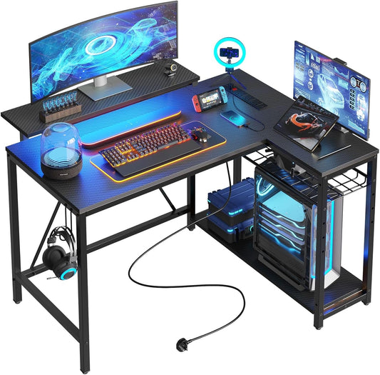 Bestier L-Shaped Gaming Desk with 3 Power Outlets & 2 USB Ports, 106.5cm Reversible Corner Desk with Carbon Fibre Surface, RGB LED Lights, Shelves & Hooks for Home Office or Small Spaces