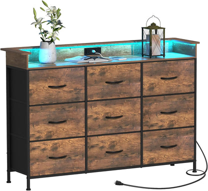EXOTICA Industrial Dresser for Bedroom with Charging Station and LED Light Fabric Storage Dresser with 9 Fabric Drawers Chest of Drawers for Closet Hallway Sturdy Steel Frame Wooden Top