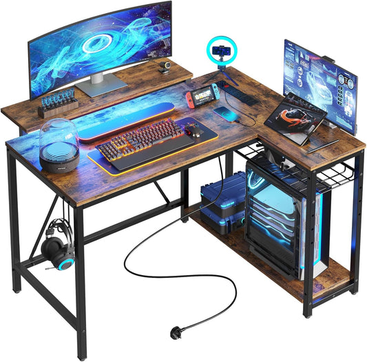Bestier L-Shaped Gaming Desk with 3 Power Outlets & 2 USB Ports, 106.5cm Reversible Corner Desk with Carbon Fibre Surface, RGB LED Lights, Shelves & Hooks for Home Office or Small Spaces